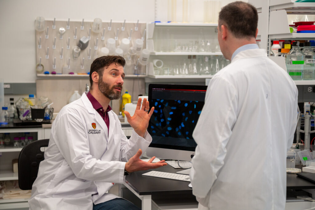 Dr. Dustin Pearson (Left) and Dr. Aaron Goodarzi (Right) in the Transdisciplinary Cancer Research Hub (Photo Credit: Glynnis Mutch, University of Calgary)