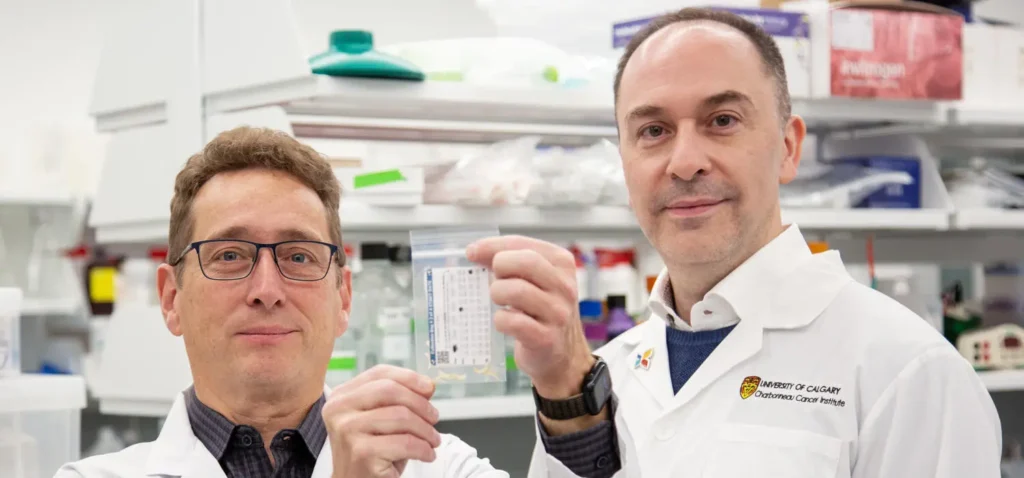 Michael Weiser, left, and Aaron Goodarzi hold one of the toenail clipping collection bags. (Phot Credit: Colleen De Neve)